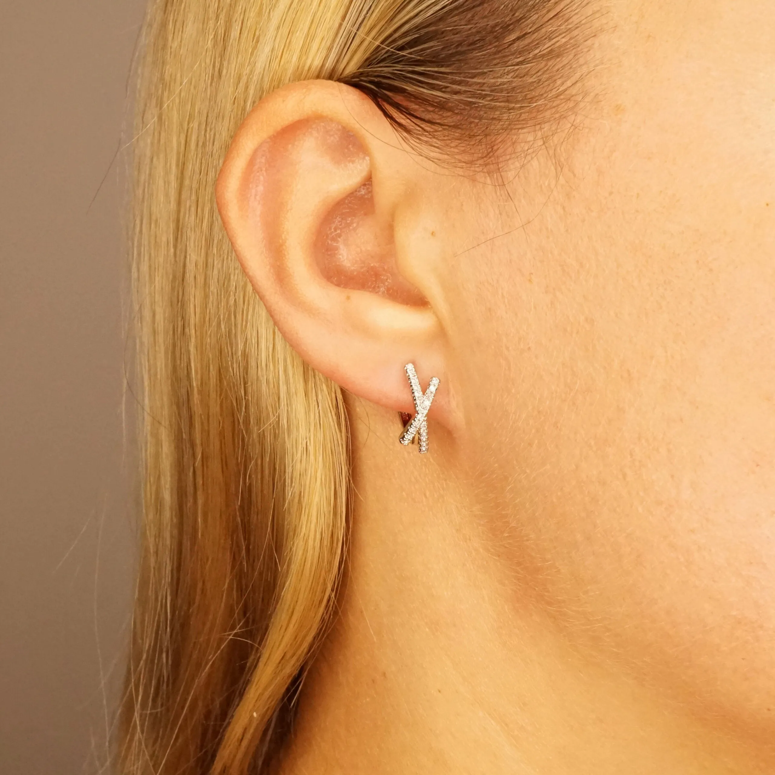Ava X - Crystal Huggie Hoop Earrings in Gold or Silver