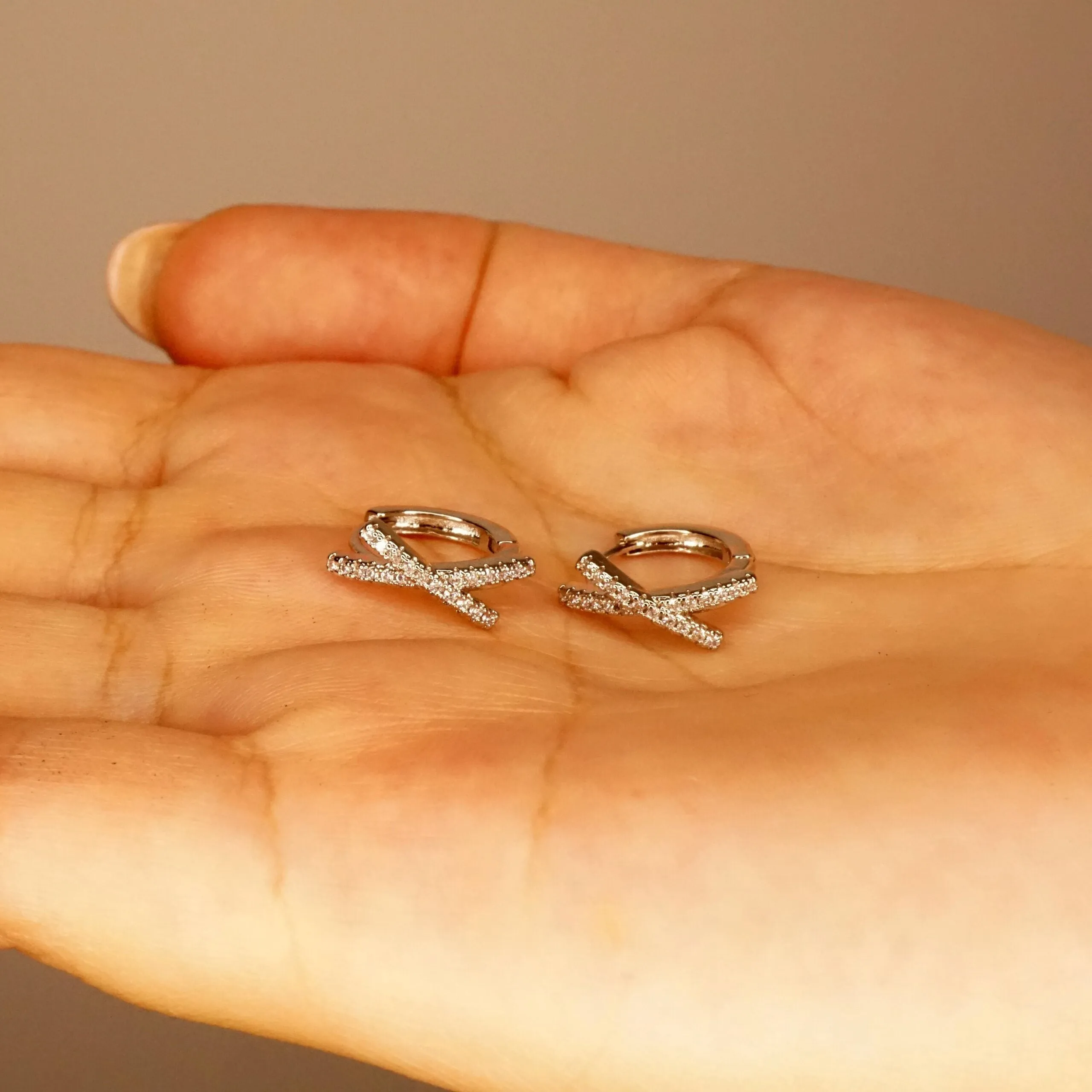 Ava X - Crystal Huggie Hoop Earrings in Gold or Silver